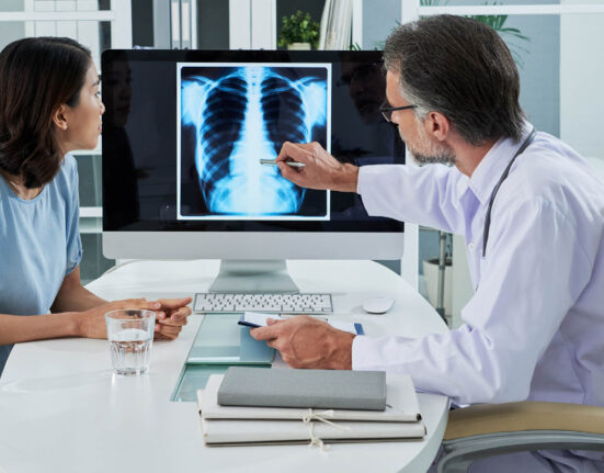 Doctor and patient looking at lung cancer diagnosis