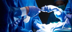 Surgeons passing scissors to each other